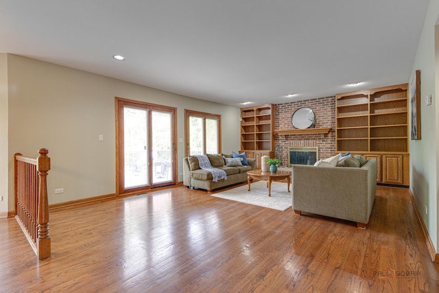 337 S Harrison Ct, Palatine, IL 60067 - living room with wood finished floors, a fireplace, built in shelves, baseboards, and recessed lighting
