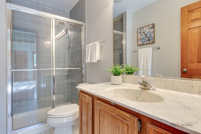 337 S Harrison Ct, Palatine, IL 60067 - full bathroom featuring vanity, toilet, a tile shower, and tile patterned flooring