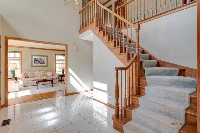 337 S Harrison Ct, Palatine, IL 60067 - stairs with a high ceiling, tile patterned floors, and baseboards