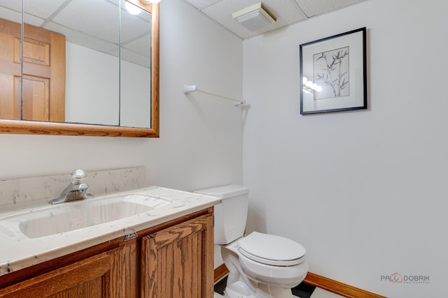 337 S Harrison Ct, Palatine, IL 60067 - bathroom featuring a drop ceiling, toilet, vanity, and baseboards