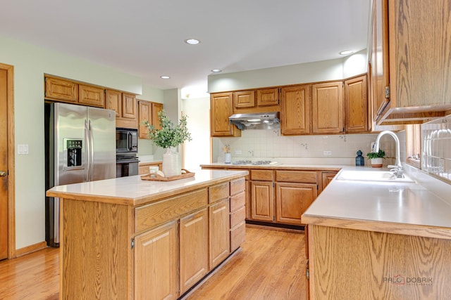 337 S Harrison Ct, Palatine, IL 60067 - kitchen with black appliances, a sink, light wood-style flooring, light countertops, and recessed lighting