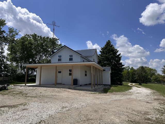 2452 E 350th Rd, Oglesby, IL 61348 - view of front of house featuring metal roof, a porch, and driveway