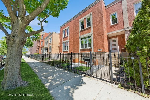3125 S Giles Ave, Chicago, IL 60616 - view of building exterior featuring a fenced front yard and a residential view