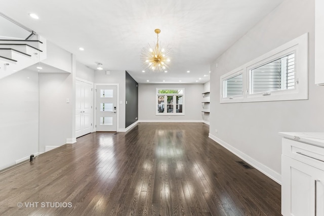 3125 S Giles Ave, Chicago, IL 60616 - unfurnished living room with a chandelier, wood finished floors, baseboards, stairs, and recessed lighting