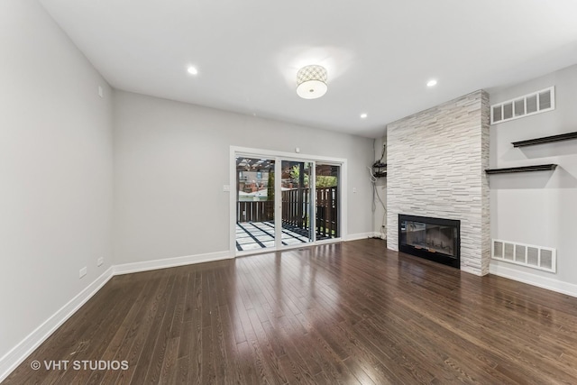 3125 S Giles Ave, Chicago, IL 60616 - unfurnished living room with wood finished floors, a tile fireplace, baseboards, and recessed lighting
