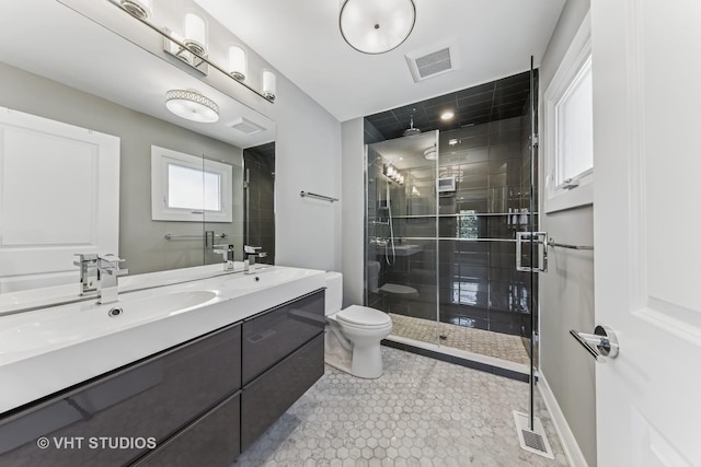 3125 S Giles Ave, Chicago, IL 60616 - full bath featuring a shower stall, double vanity, toilet, tile patterned floors, and baseboards