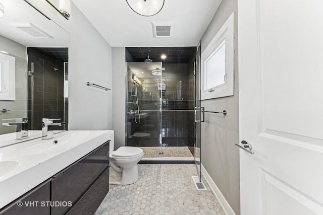 3125 S Giles Ave, Chicago, IL 60616 - full bathroom with a stall shower, vanity, toilet, tile patterned flooring, and baseboards