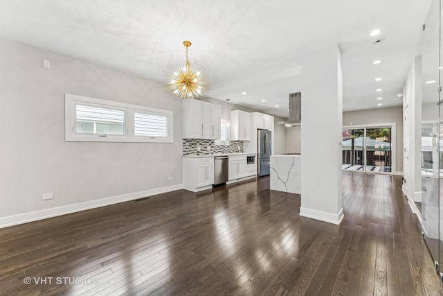 3125 S Giles Ave, Chicago, IL 60616 - unfurnished living room featuring dark wood finished floors, baseboards, and recessed lighting
