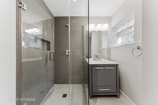 3125 S Giles Ave, Chicago, IL 60616 - bathroom featuring tile patterned floors, vanity, and a shower stall