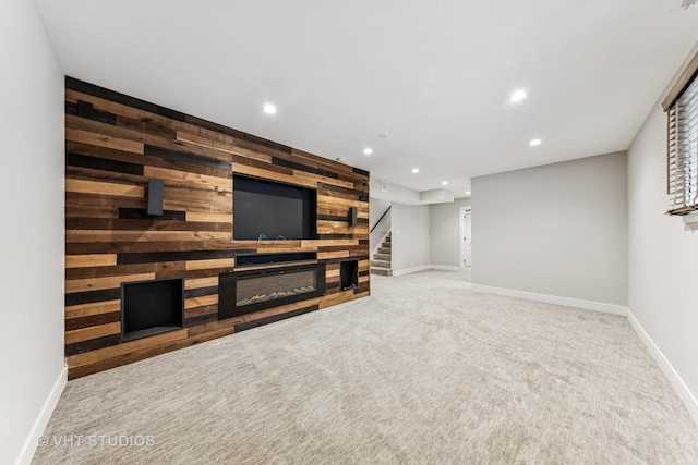 3125 S Giles Ave, Chicago, IL 60616 - unfurnished living room with recessed lighting, baseboards, carpet flooring, wooden walls, and stairs