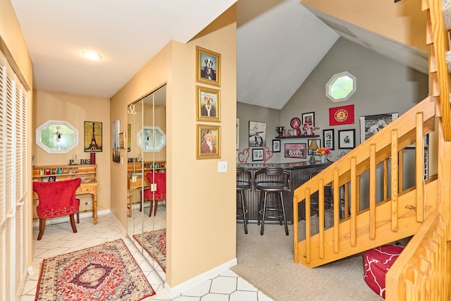 202 Country Ln Unit 202, Des Plaines, IL 60016 - corridor with vaulted ceiling, baseboards, and stairway