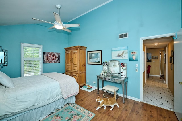 202 Country Ln Unit 202, Des Plaines, IL 60016 - bedroom with high vaulted ceiling, wood finished floors, baseboards, and a ceiling fan