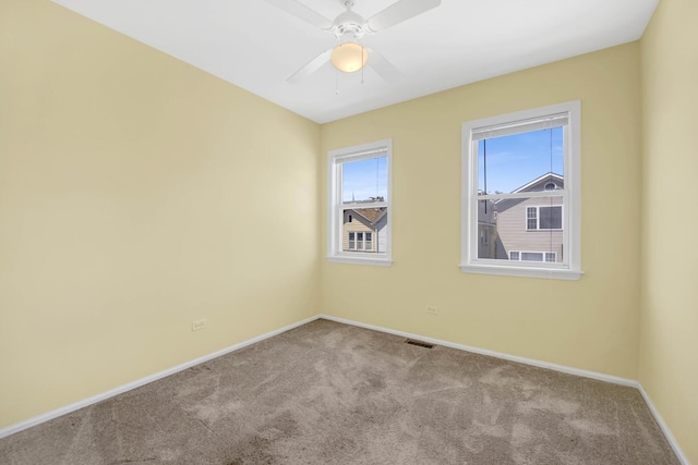 1157 W 19th Pl, Chicago, IL 60608 - carpeted empty room with baseboards and a ceiling fan