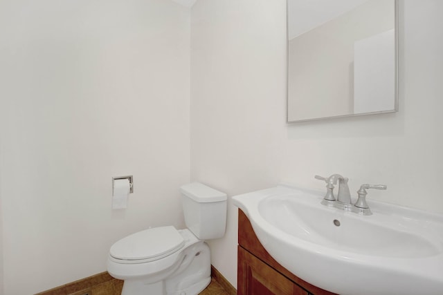 1157 W 19th Pl, Chicago, IL 60608 - bathroom featuring vanity, toilet, and baseboards