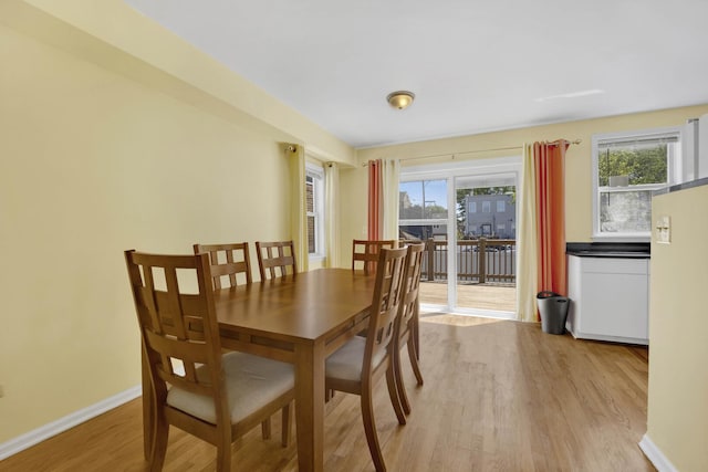 1157 W 19th Pl, Chicago, IL 60608 - dining area featuring light wood-style floors, healthy amount of natural light, and baseboards