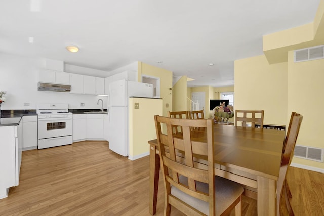 1157 W 19th Pl, Chicago, IL 60608 - dining space featuring light wood finished floors