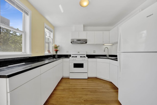 1157 W 19th Pl, Chicago, IL 60608 - kitchen featuring white appliances, a sink, dark countertops, and white cabinetry