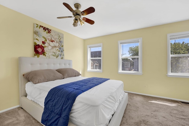 1157 W 19th Pl, Chicago, IL 60608 - bedroom with carpet floors, multiple windows, baseboards, and ceiling fan