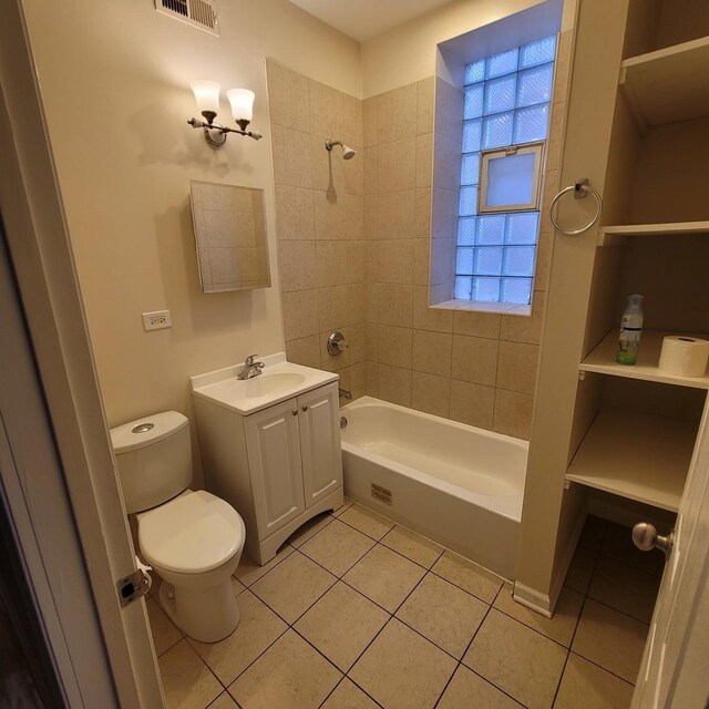 6033 S Prairie Ave, Chicago, IL 60637 - full bath with tile patterned flooring, toilet, vanity, and shower / bathtub combination