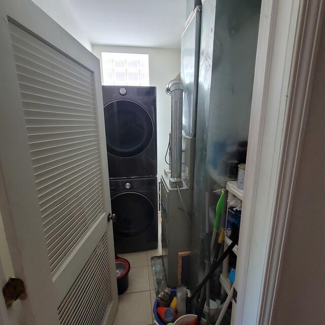 6033 S Prairie Ave, Chicago, IL 60637 - washroom featuring stacked washer and clothes dryer and tile patterned floors