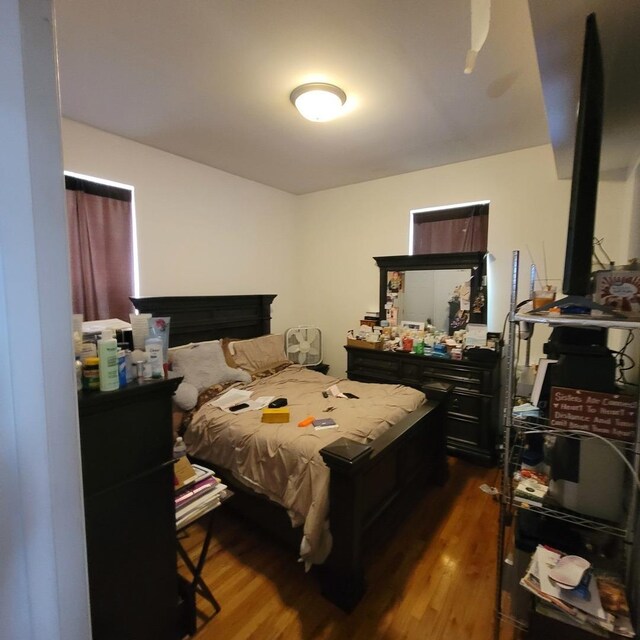 6033 S Prairie Ave, Chicago, IL 60637 - bedroom with dark wood-type flooring