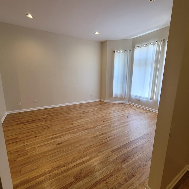 6033 S Prairie Ave, Chicago, IL 60637 - empty room featuring light wood-type flooring, baseboards, and recessed lighting