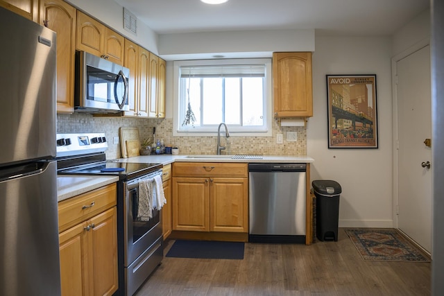 9452 Bay Colony Dr Unit 2W, Des Plaines, IL 60016 - kitchen with appliances with stainless steel finishes, light countertops, backsplash, and a sink
