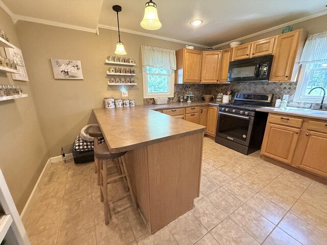 202 17th Ave, Sterling, IL 61081 - kitchen featuring black microwave, stainless steel range with gas stovetop, ornamental molding, a peninsula, and decorative backsplash