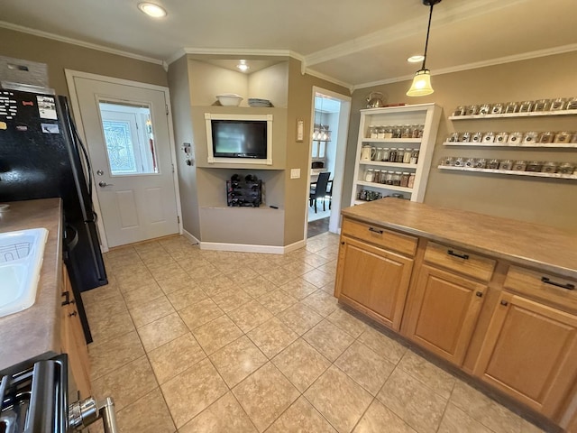 202 17th Ave, Sterling, IL 61081 - kitchen featuring crown molding, light tile patterned floors, pendant lighting, light countertops, and baseboards