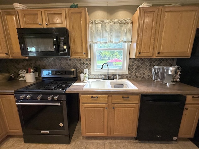 202 17th Ave, Sterling, IL 61081 - kitchen featuring black appliances, a sink, tasteful backsplash, and light countertops