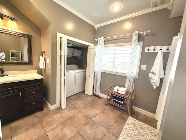 202 17th Ave, Sterling, IL 61081 - bathroom with independent washer and dryer, crown molding, vanity, tile patterned flooring, and baseboards