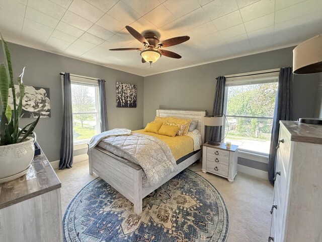 202 17th Ave, Sterling, IL 61081 - bedroom with light colored carpet, a ceiling fan, baseboards, and ornamental molding