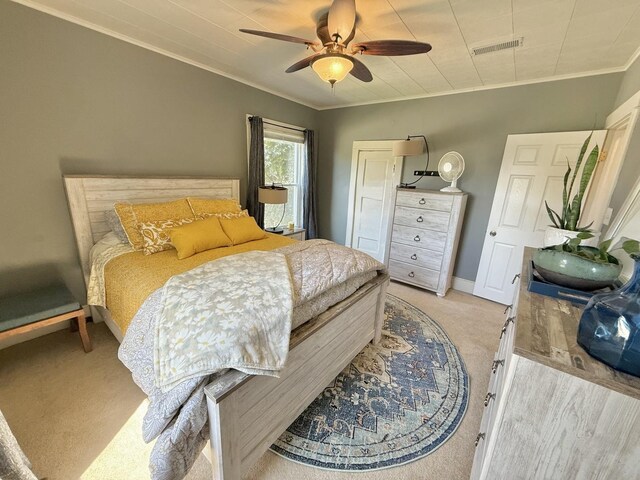 202 17th Ave, Sterling, IL 61081 - bedroom featuring light colored carpet, ornamental molding, baseboards, and a ceiling fan