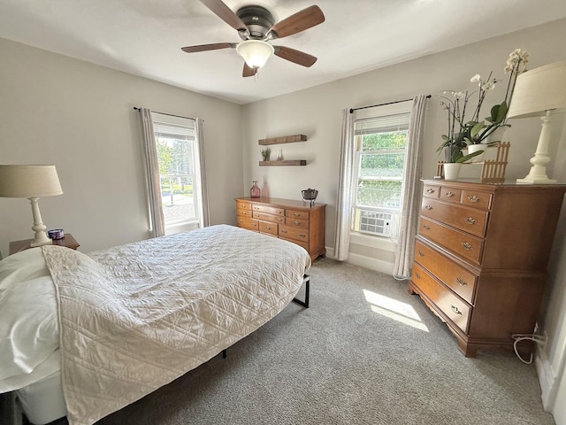 202 17th Ave, Sterling, IL 61081 - bedroom featuring light carpet, multiple windows, a ceiling fan, and cooling unit