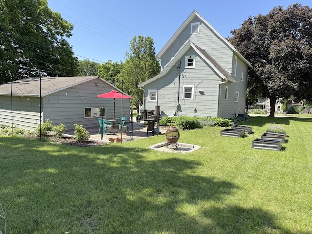 202 17th Ave, Sterling, IL 61081 - back of property featuring a lawn and a patio