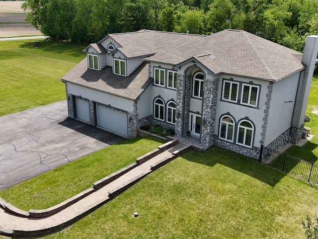 18609 Pinon Trl, Marengo, IL 60152 - french country style house with stone siding, stucco siding, roof with shingles, asphalt driveway, and a garage