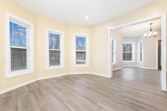 200 Reichman St, Joliet, IL 60433 - empty room with a chandelier, wood finished floors, baseboards, and recessed lighting