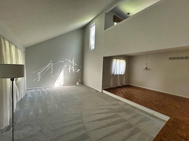 1622 Indian Knoll Rd, Naperville, IL 60565 - unfurnished living room featuring carpet flooring, healthy amount of natural light, high vaulted ceiling, and baseboards