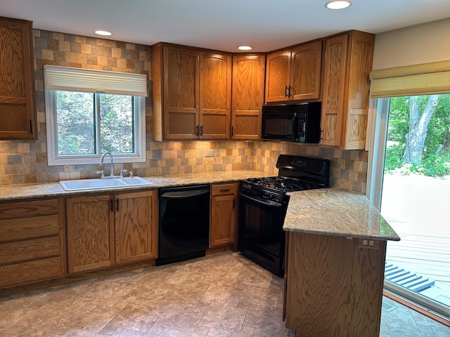 1622 Indian Knoll Rd, Naperville, IL 60565 - kitchen featuring black appliances, a sink, backsplash, brown cabinetry, and recessed lighting