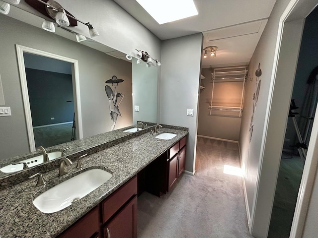 1622 Indian Knoll Rd, Naperville, IL 60565 - bathroom with double vanity, a spacious closet, and baseboards
