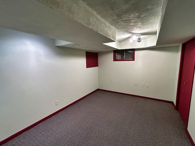 1622 Indian Knoll Rd, Naperville, IL 60565 - finished basement with a textured ceiling, carpet floors, and baseboards