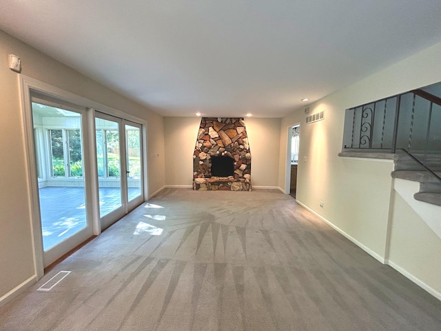 1622 Indian Knoll Rd, Naperville, IL 60565 - unfurnished living room with carpet floors, stairs, baseboards, recessed lighting, and a stone fireplace