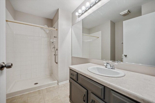 30W014 Willow Ln Unit 1, Warrenville, IL 60555 - full bathroom featuring vanity, a tile shower, and tile patterned floors
