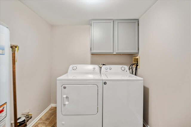 30W014 Willow Ln Unit 1, Warrenville, IL 60555 - washroom with washer and dryer, cabinet space, baseboards, and water heater