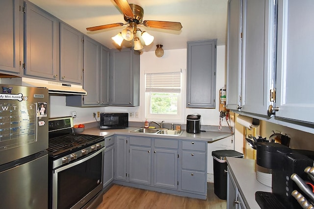 717 Carlisle Rd, Batavia, IL 60510 - kitchen with appliances with stainless steel finishes, gray cabinets, under cabinet range hood, light wood finished floors, and ceiling fan