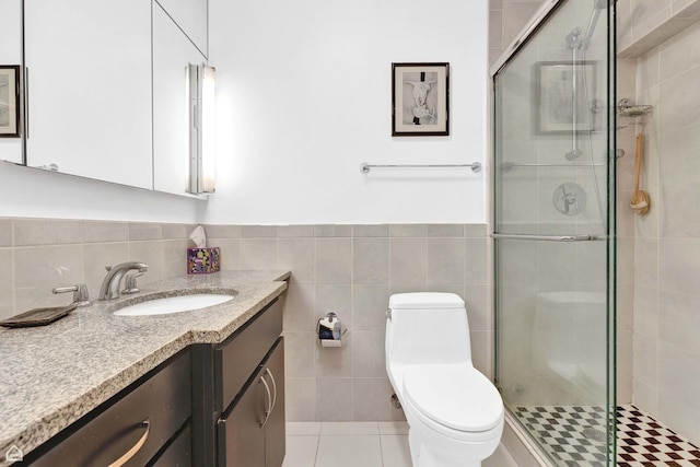 5455 N Sheridan Rd Unit 2206, Chicago, IL 60640 - full bath featuring vanity, tile walls, a stall shower, toilet, and a wainscoted wall
