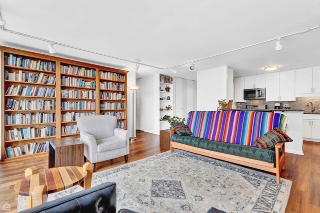 5455 N Sheridan Rd Unit 2206, Chicago, IL 60640 - living room featuring rail lighting and wood finished floors