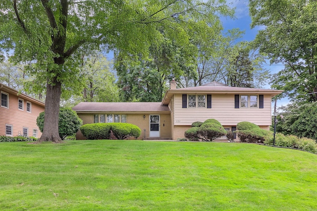 1131 Blanchard St, Downers Grove, IL 60516 - tri-level home featuring a chimney, a front yard, and brick siding