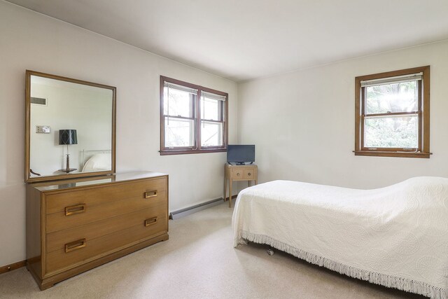 1131 Blanchard St, Downers Grove, IL 60516 - bedroom featuring a baseboard radiator, multiple windows, baseboards, and light colored carpet