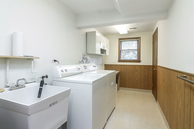 1131 Blanchard St, Downers Grove, IL 60516 - laundry room featuring cabinet space, washing machine and clothes dryer, a wainscoted wall, light floors, and wooden walls